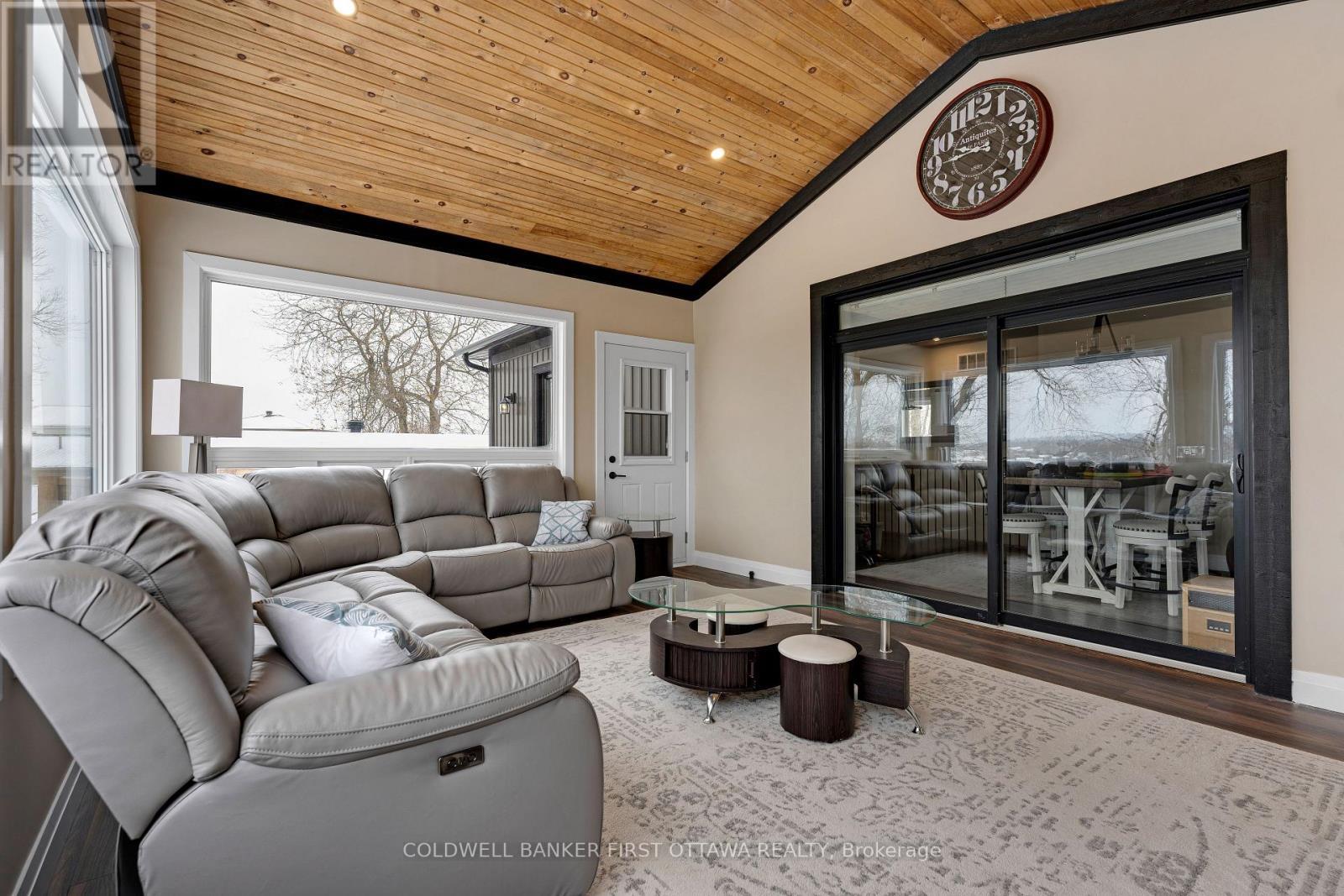 Patio doors lead to new 2025 sunroom - 38 Tuttle Point Road, Edwardsburgh/Cardinal, ON - Indoor Photo Showing Living Room