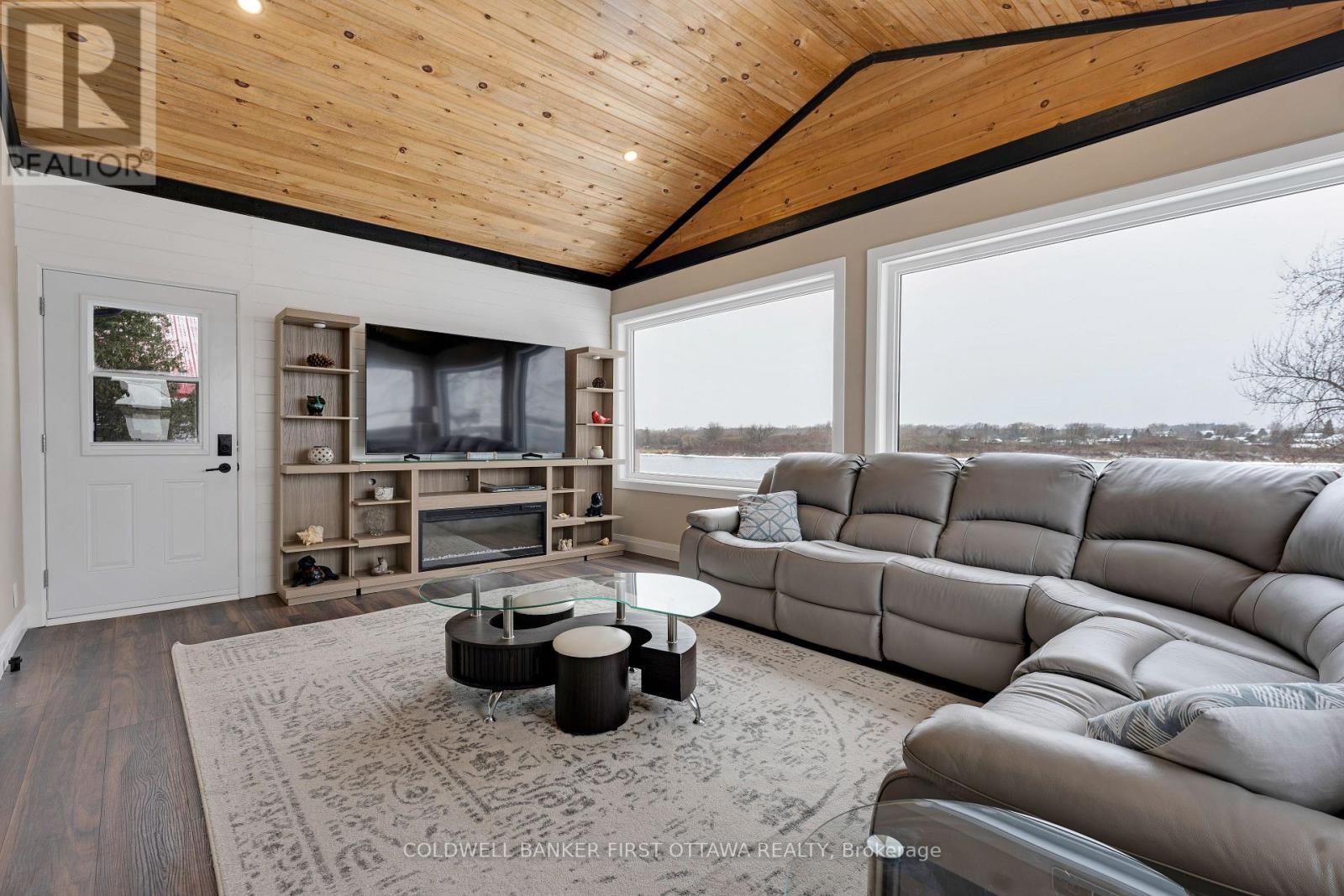 Laminate plank floors & hookup for gas fireplace - 38 Tuttle Point Road, Edwardsburgh/Cardinal, ON - Indoor Photo Showing Living Room
