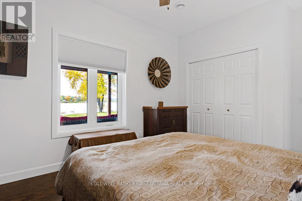 Lower level second bedroom, also has double closet - 38 Tuttle Point Road, Edwardsburgh/Cardinal, ON - Indoor Photo Showing Bedroom