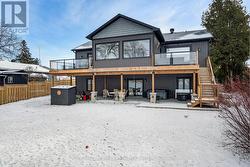 Home's sunroom, upper deck & walkout lower level -