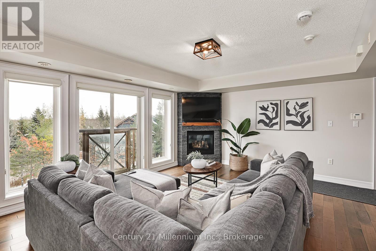 201 - 6 Joseph Trail, Collingwood, ON - Indoor Photo Showing Living Room With Fireplace