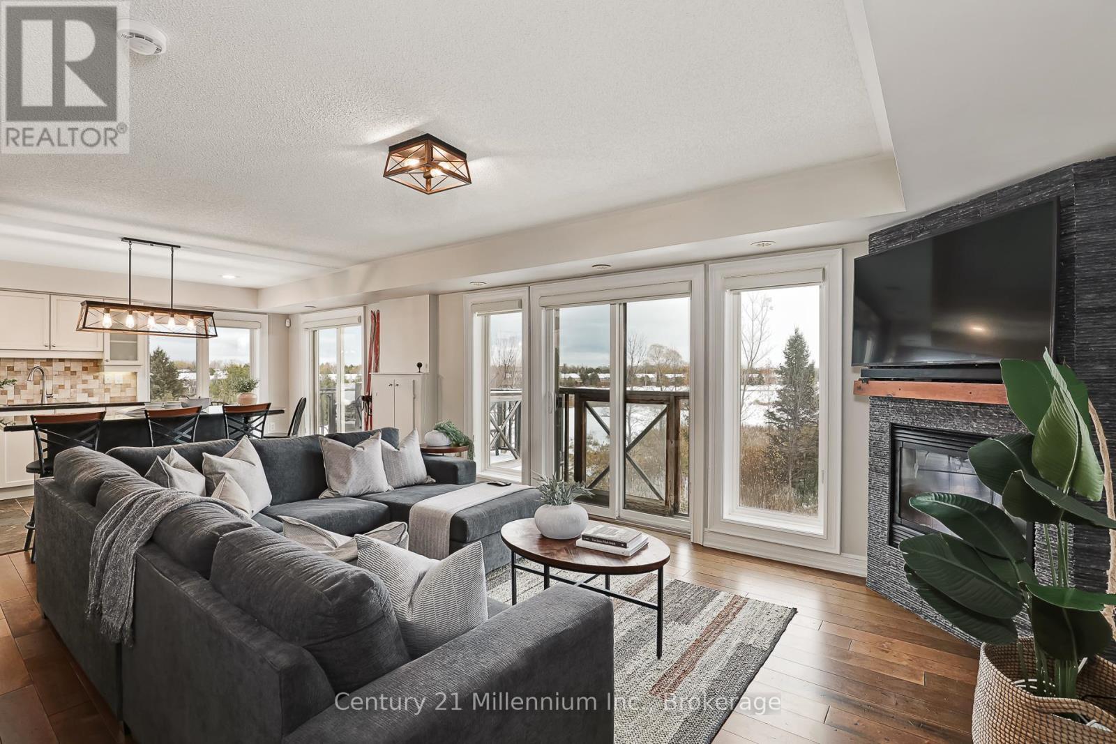 201 - 6 Joseph Trail, Collingwood, ON - Indoor Photo Showing Living Room With Fireplace