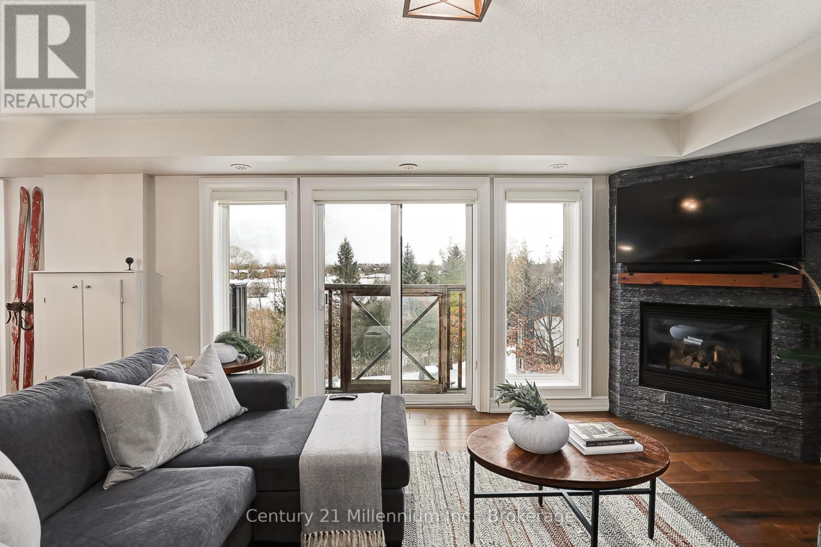 201 - 6 Joseph Trail, Collingwood, ON - Indoor Photo Showing Living Room With Fireplace
