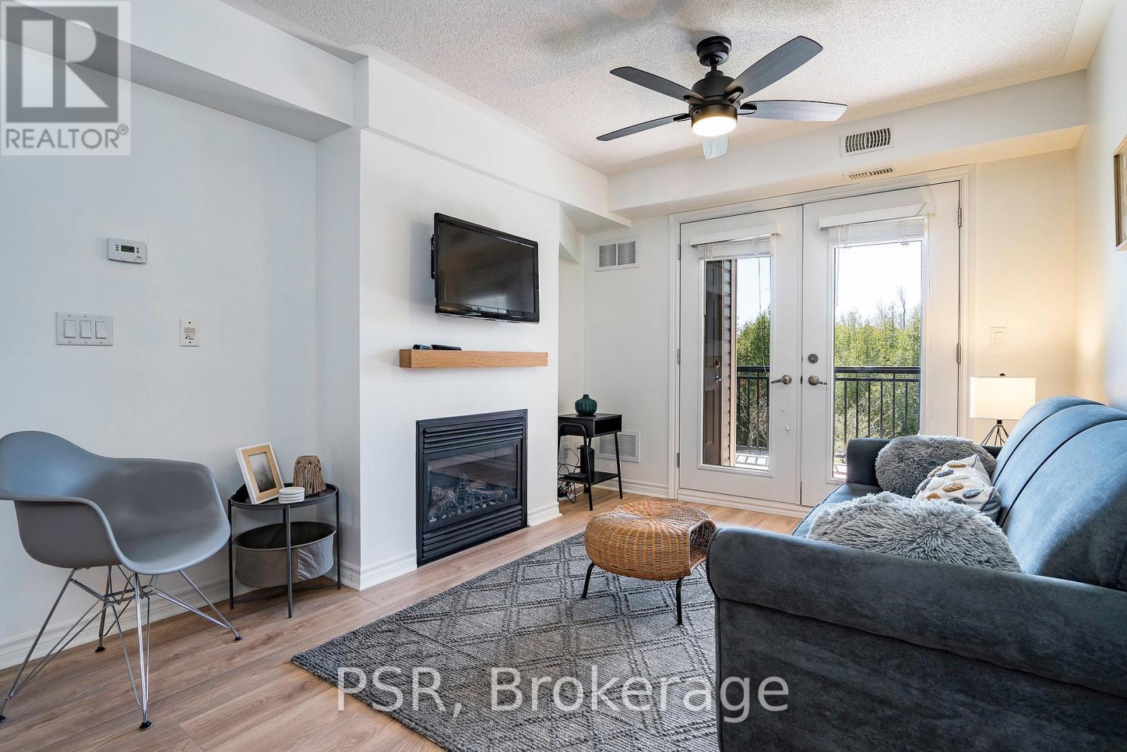 204 - 8 Brandy Lane Drive, Collingwood, ON - Indoor Photo Showing Living Room With Fireplace