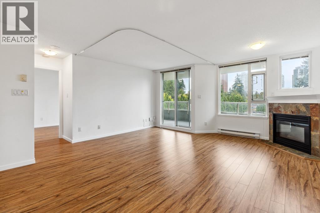 605 7108 Edmonds Street, Burnaby, BC - Indoor Photo Showing Living Room With Fireplace
