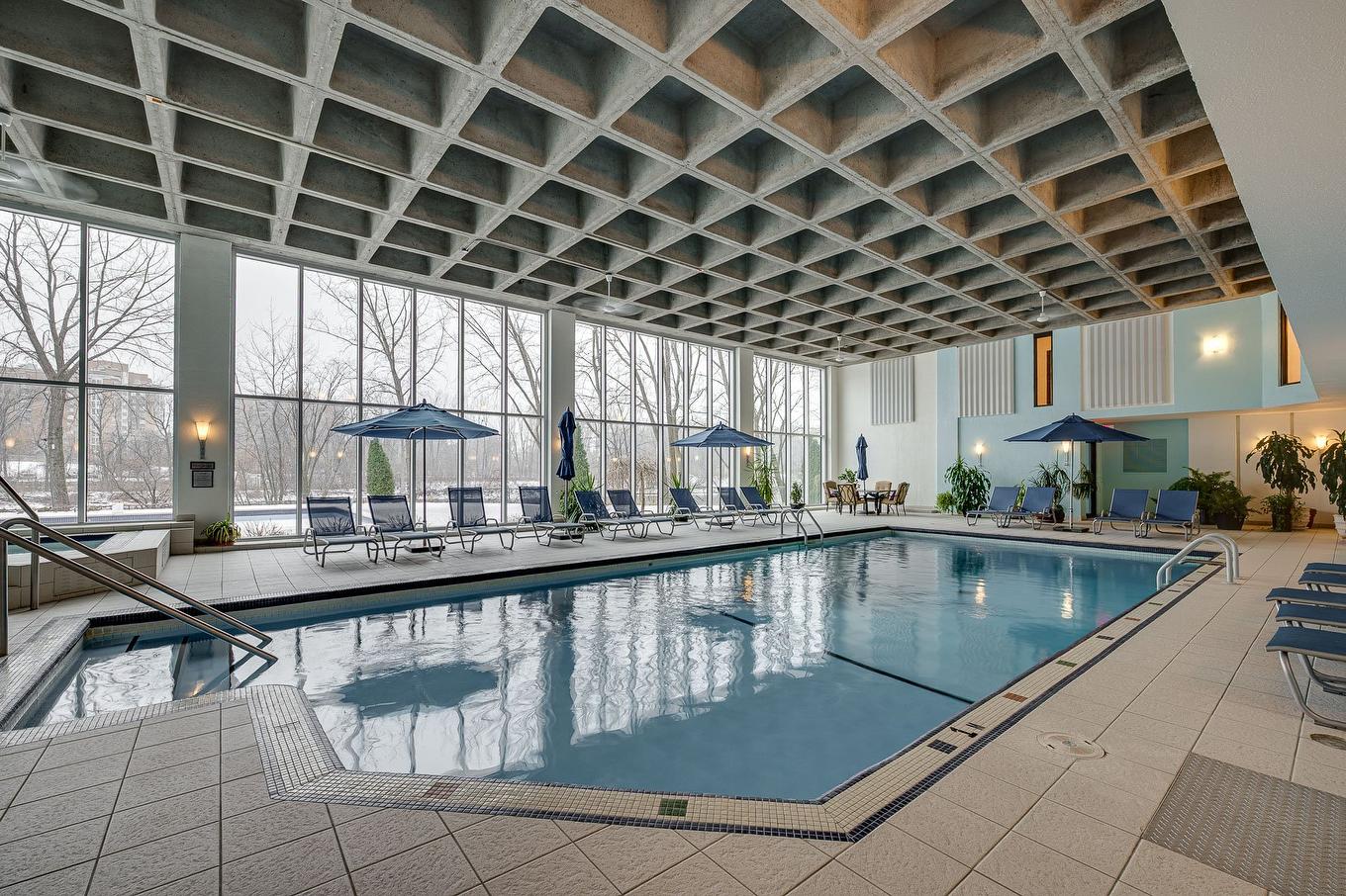 Piscine - 1005-4300 Place Des Cageux, Laval (Chomedey), QC - Indoor Photo Showing Other Room With In Ground Pool