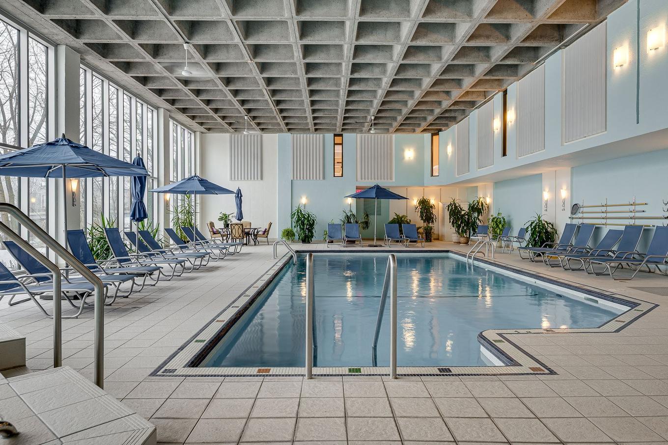 Piscine - 1005-4300 Place Des Cageux, Laval (Chomedey), QC - Indoor Photo Showing Other Room With In Ground Pool