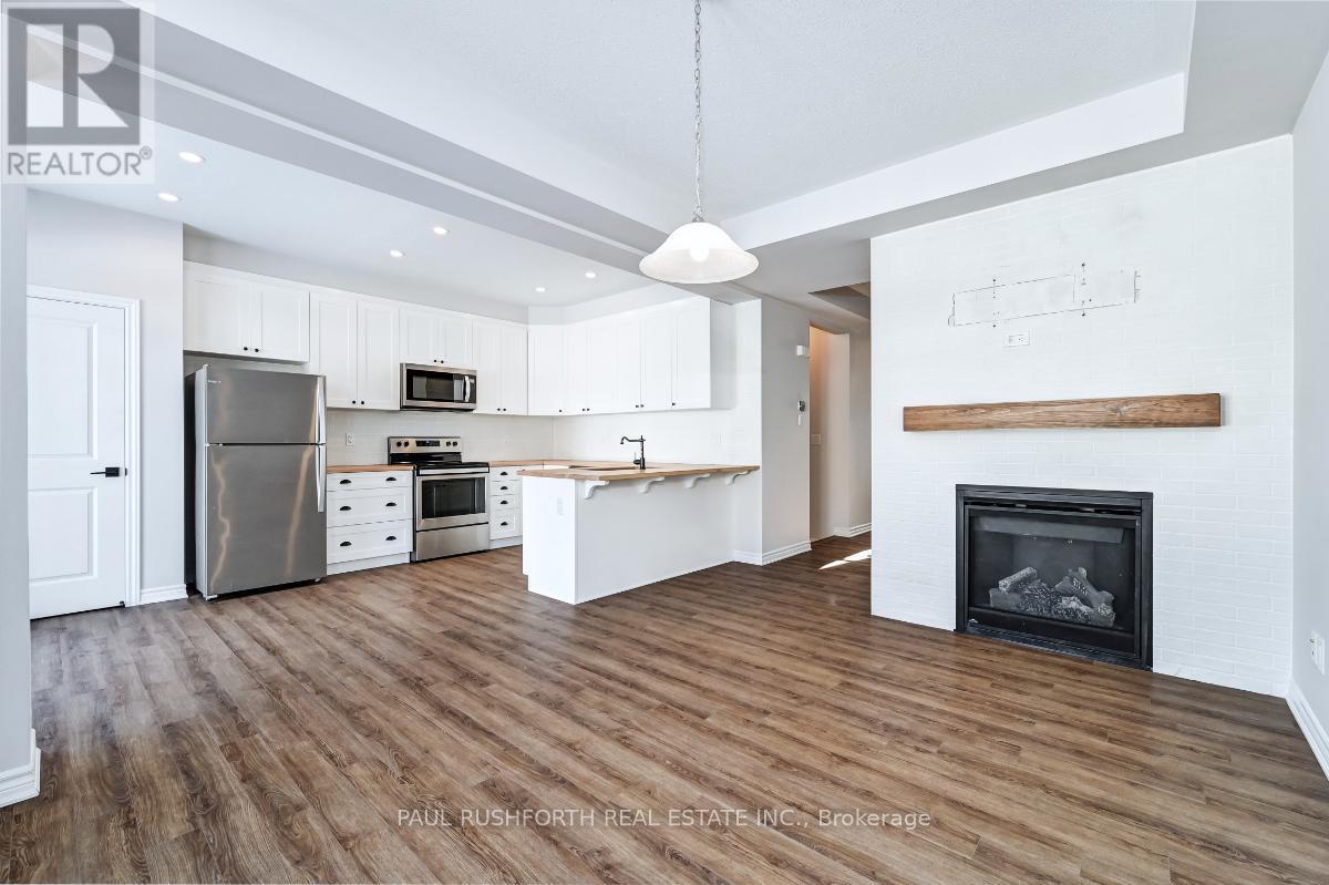 Living Room Area - 123 Pictou Crescent, Ottawa, ON - Indoor Photo Showing Kitchen With Fireplace With Stainless Steel Kitchen