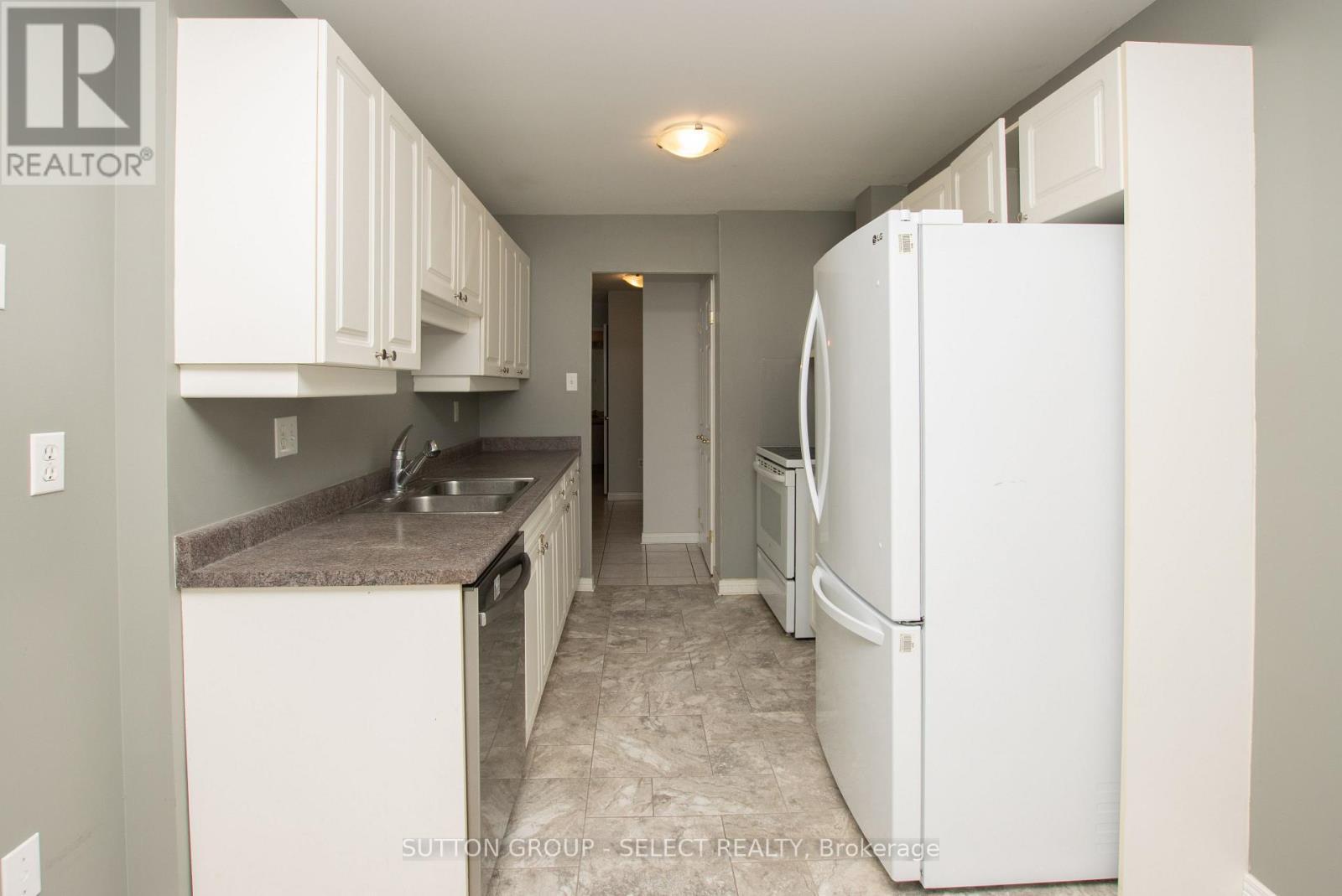 406 - 1180 Commissioners Rd W Road, London South (South B), ON - Indoor Photo Showing Kitchen With Double Sink