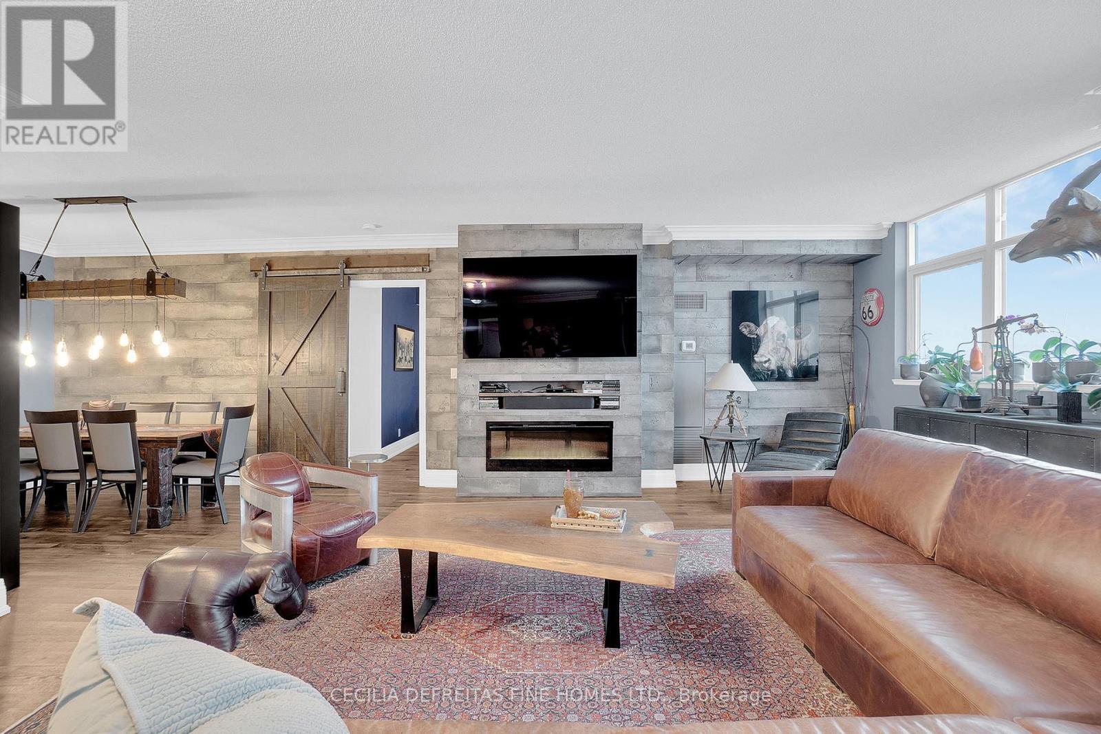 1616 - 9225 Jane Street, Vaughan, ON - Indoor Photo Showing Living Room With Fireplace