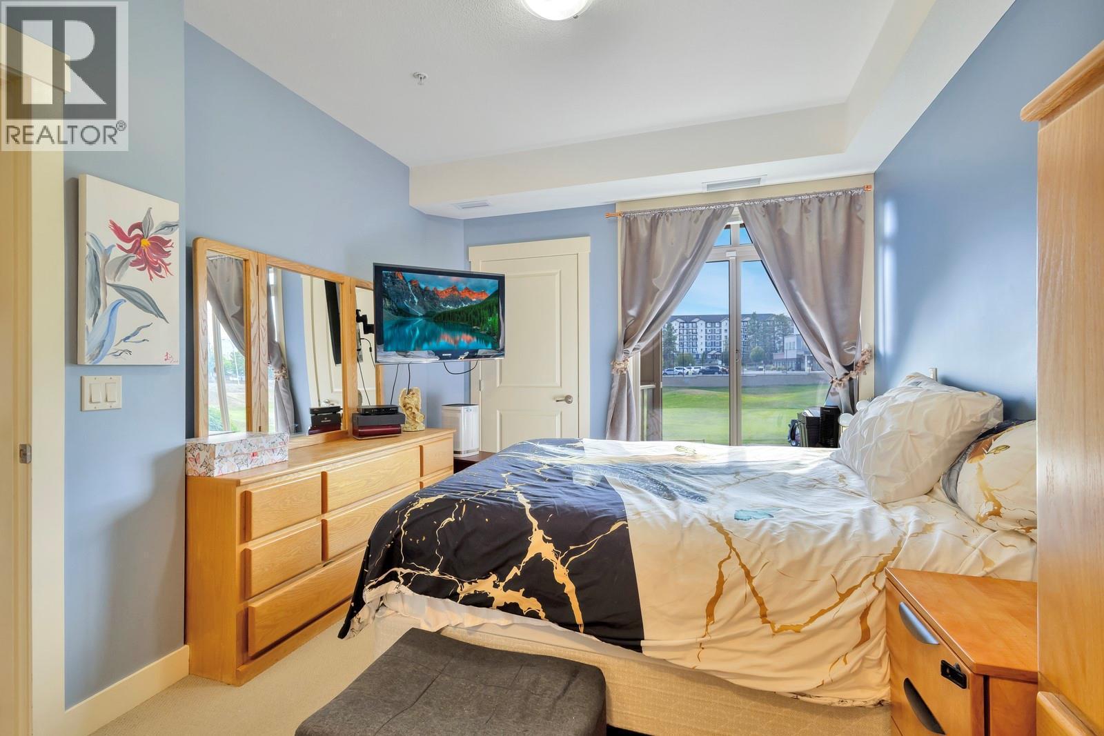 With space for larger bedroom furniture - 3533 Carrington Road Unit# 211, Westbank, BC - Indoor Photo Showing Bedroom