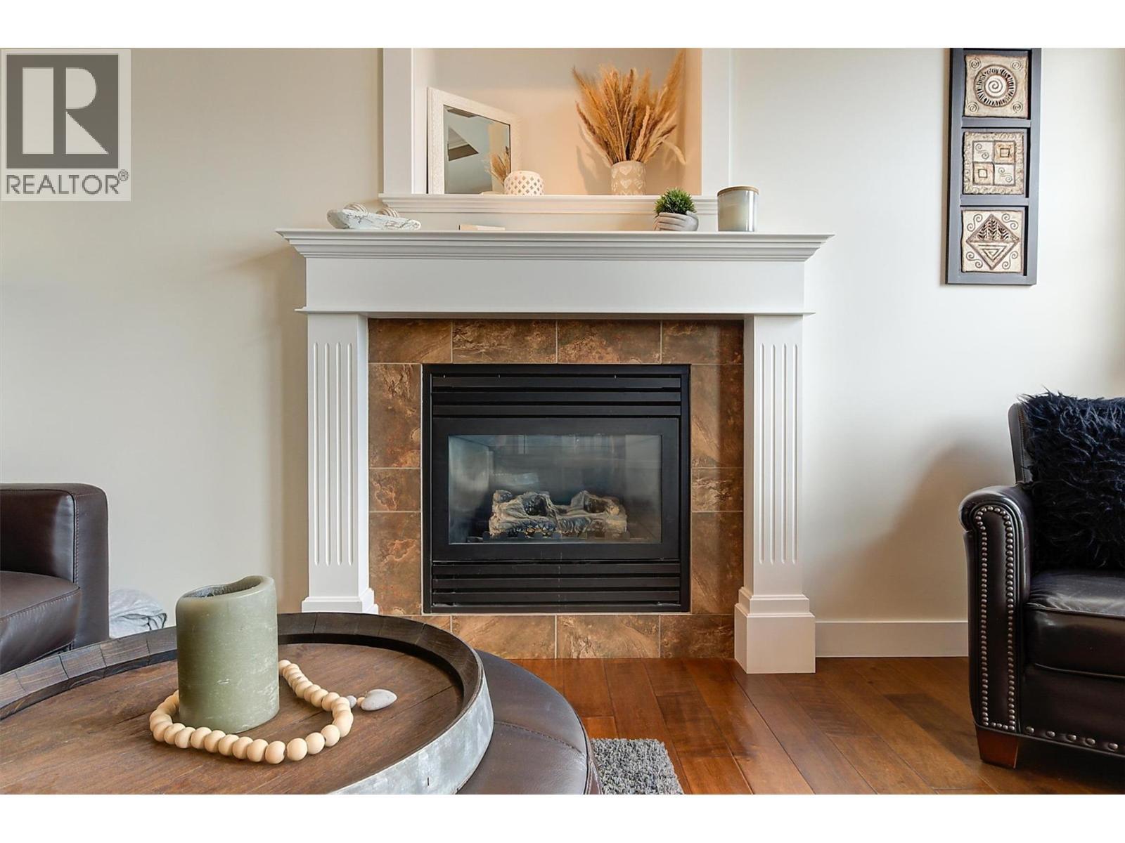 Gas Fireplace - 737 Kuipers Crescent, Kelowna, BC - Indoor Photo Showing Living Room With Fireplace