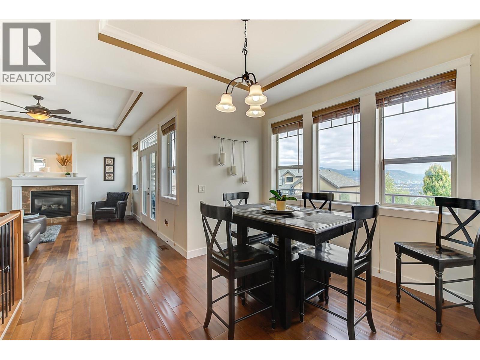 737 Kuipers Crescent, Kelowna, BC - Indoor Photo Showing Dining Room With Fireplace
