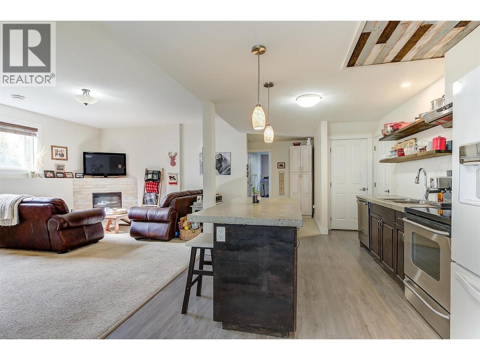 737 Kuipers Crescent, Kelowna, BC - Indoor Photo Showing Kitchen With Fireplace