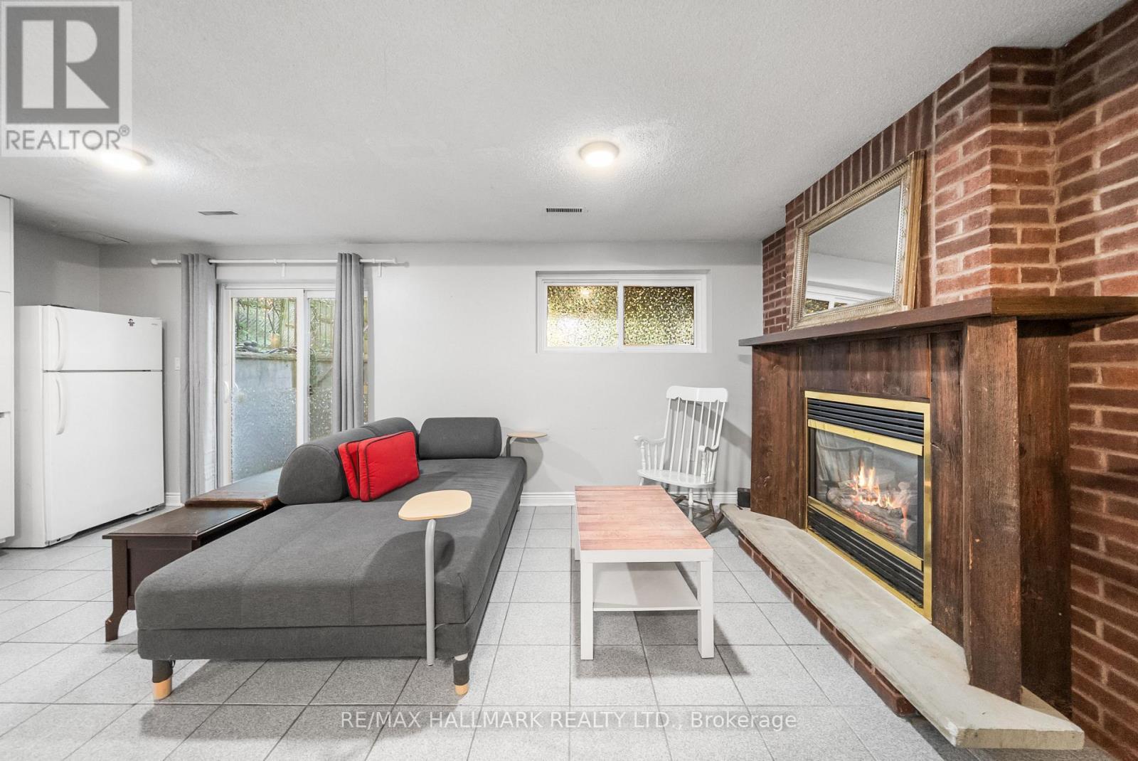 Bsmnt - 51 Watson Street, Toronto, ON - Indoor Photo Showing Living Room With Fireplace