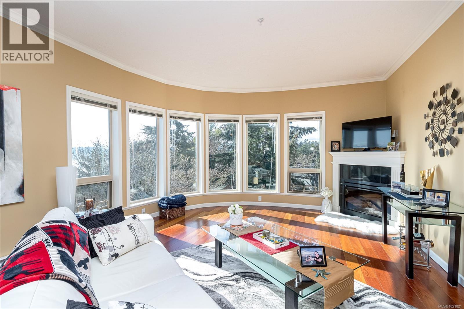 404 125 Aldersmith Pl, View Royal, BC - Indoor Photo Showing Living Room With Fireplace