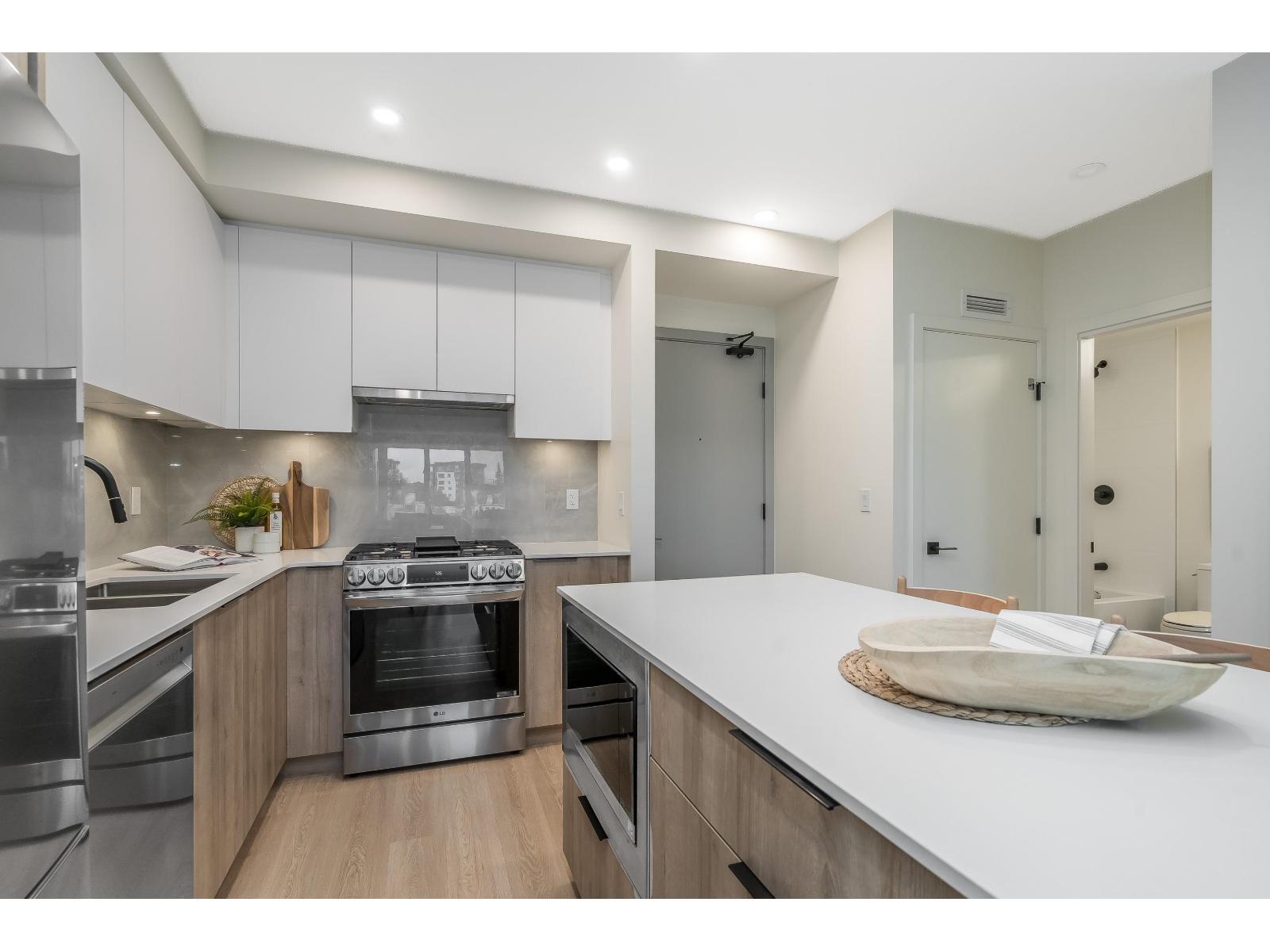 A411 7980 206A Street, Langley, BC - Indoor Photo Showing Kitchen With Double Sink With Upgraded Kitchen