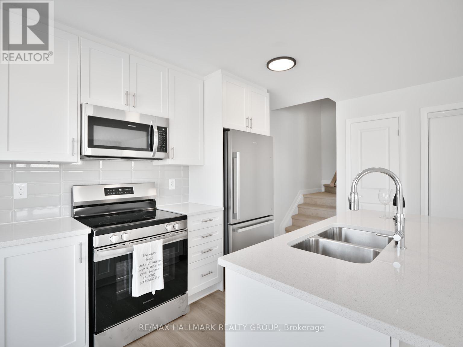 18 - 401 Glenroy Gilbert Drive, Ottawa, ON - Indoor Photo Showing Kitchen With Stainless Steel Kitchen With Double Sink