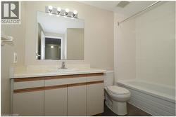 Bathroom featuring vanity and shower / bath combination -