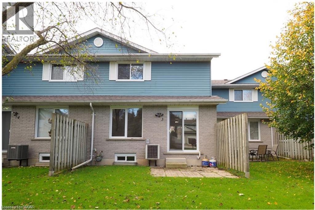 Back of house with a patio and brick siding - 455 Kingscourt Drive Unit# 3, Waterloo, ON - Outdoor