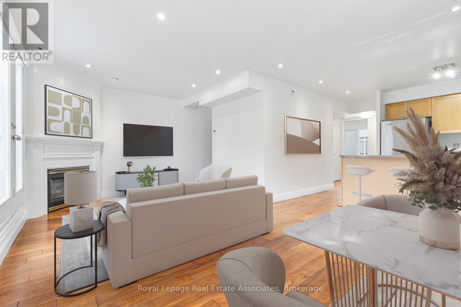 1811 - 12 Sudbury Street, Toronto, ON - Indoor Photo Showing Living Room With Fireplace