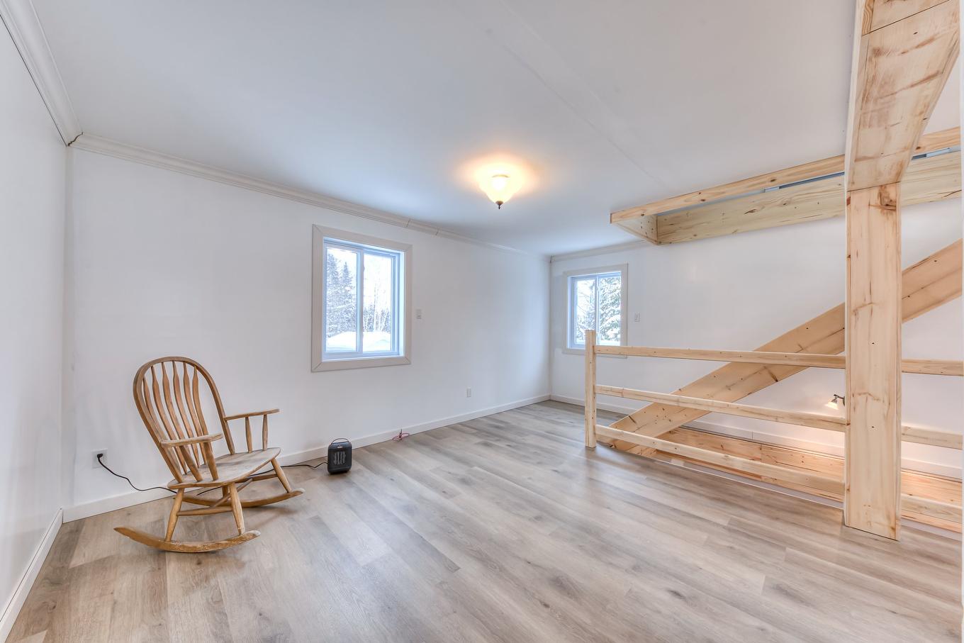 Living room - 101 Mtée Manitonga, Lac-Supérieur, QC - Indoor Photo Showing Other Room