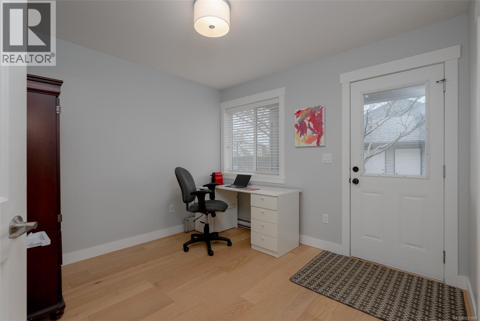 Third bedroom, can be used as office space with door leading to back patio. - 101 211 Victoria Rd, Nanaimo, BC