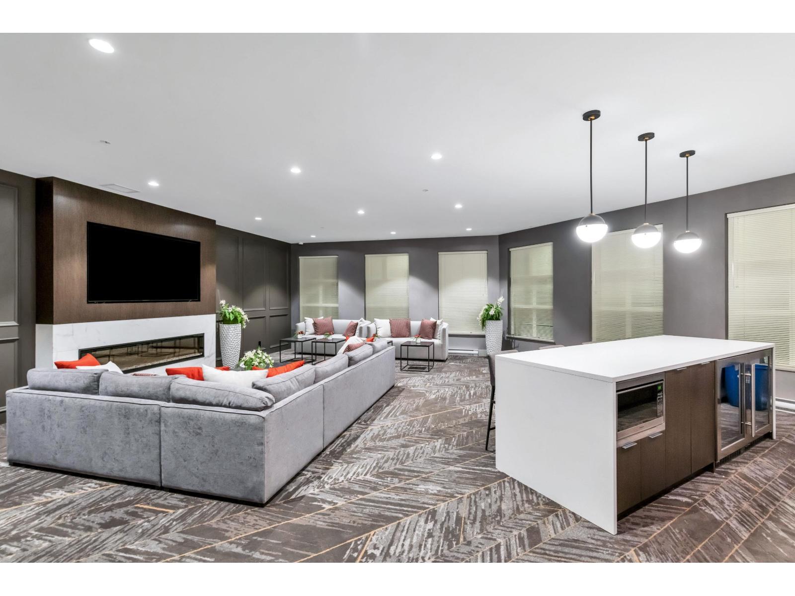 B116 8150 207 Street, Langley, BC - Indoor Photo Showing Living Room With Fireplace