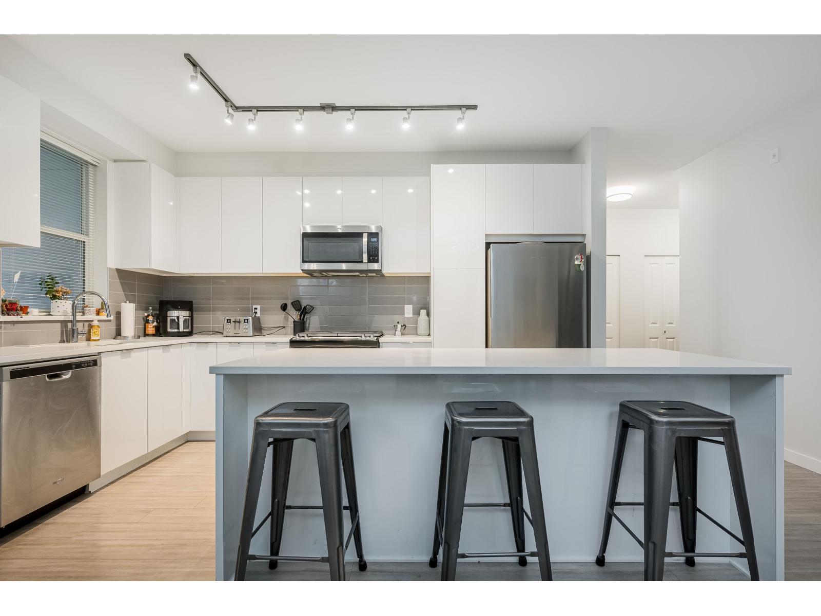 B116 8150 207 Street, Langley, BC - Indoor Photo Showing Kitchen With Stainless Steel Kitchen With Upgraded Kitchen