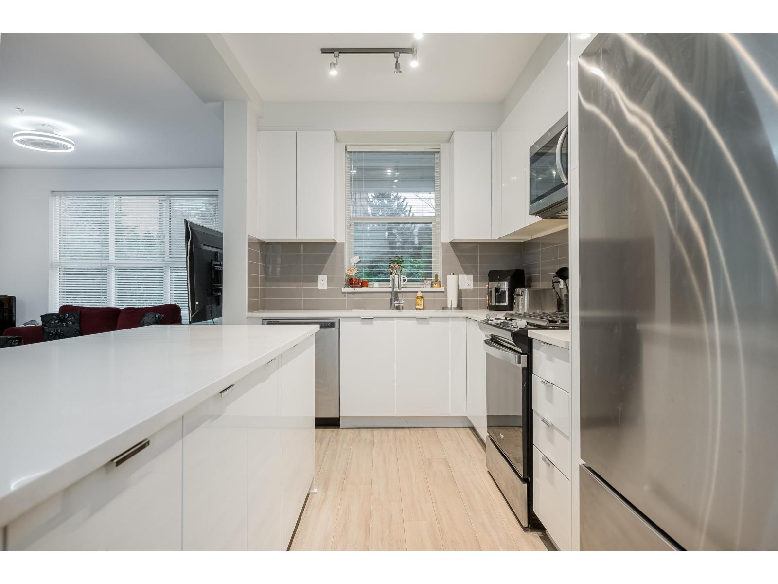 B116 8150 207 Street, Langley, BC - Indoor Photo Showing Kitchen With Stainless Steel Kitchen With Upgraded Kitchen