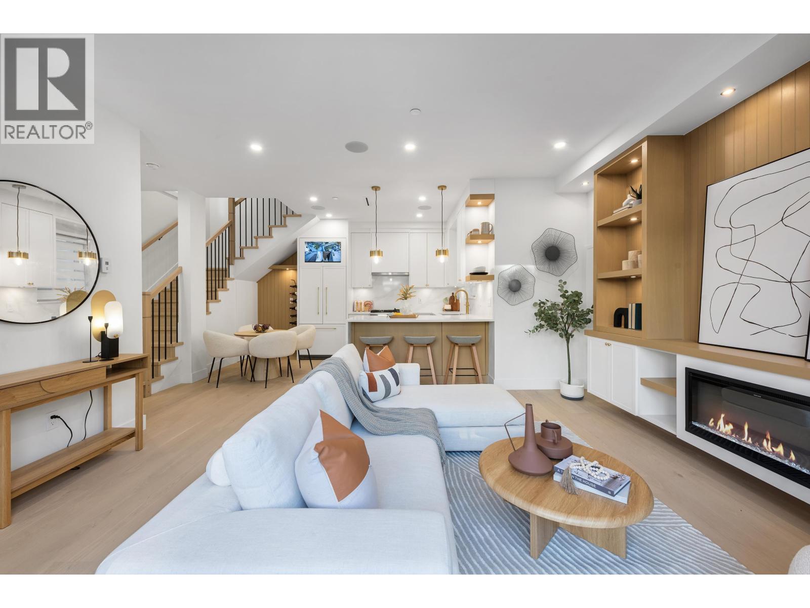 1 4855 Dumfries Street, Vancouver, BC - Indoor Photo Showing Living Room With Fireplace