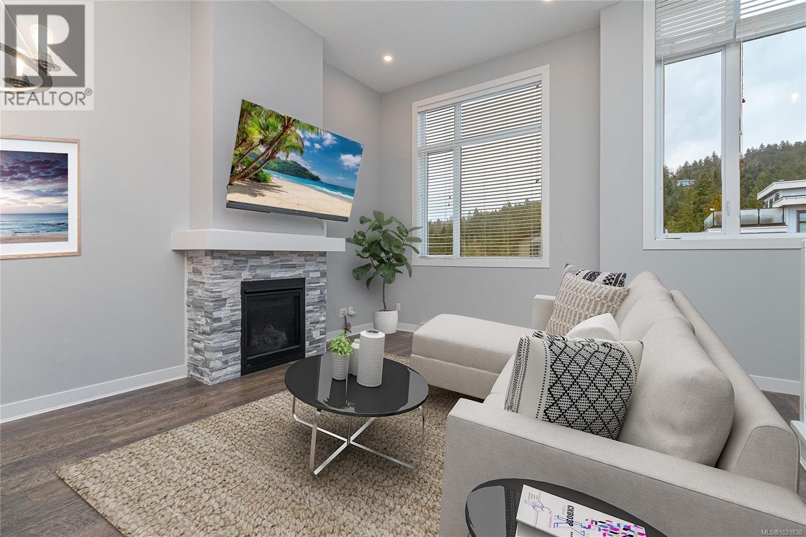 113 1201 Nova Crt, Langford, BC - Indoor Photo Showing Living Room With Fireplace