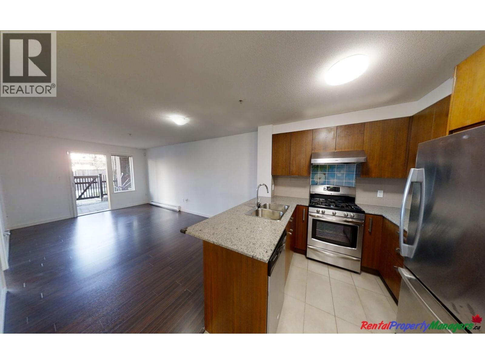 107 5885 Irmin Street, Burnaby, BC - Indoor Photo Showing Kitchen With Double Sink