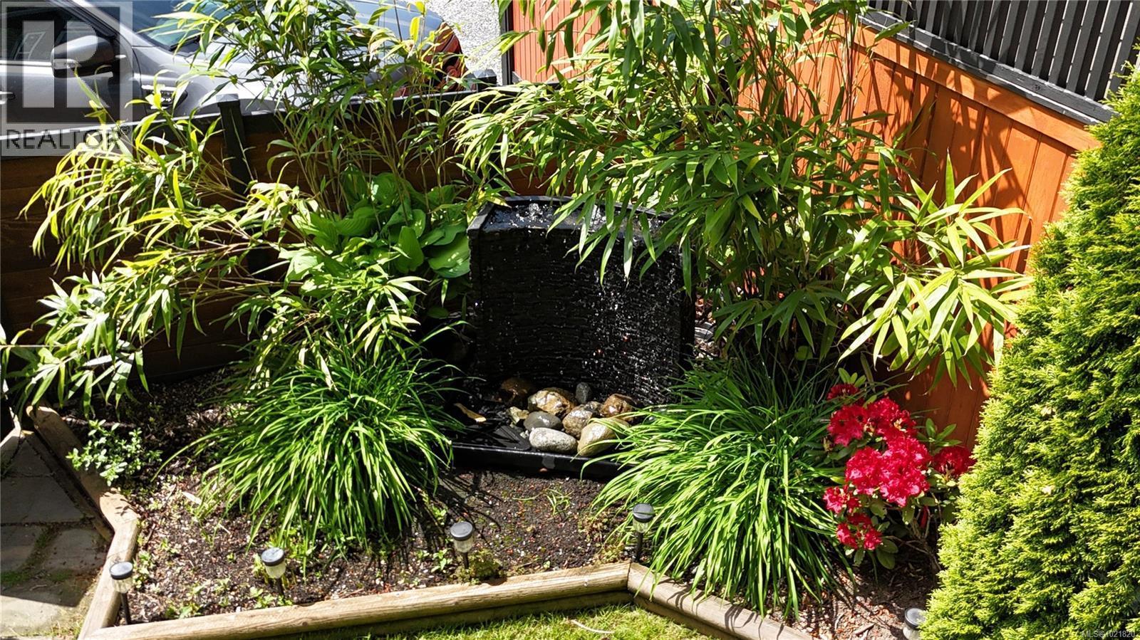 Yard and Fountain in Summer - 3126 Elsie Lake Cir, Nanaimo, BC