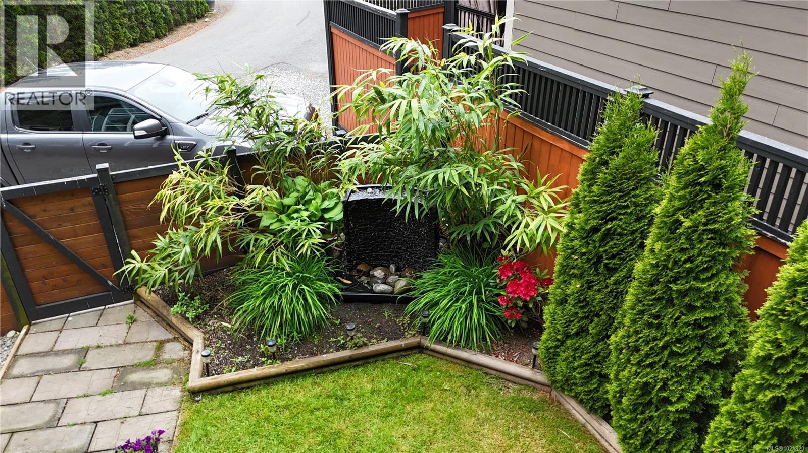 View of yard in Summer - 3126 Elsie Lake Cir, Nanaimo, BC