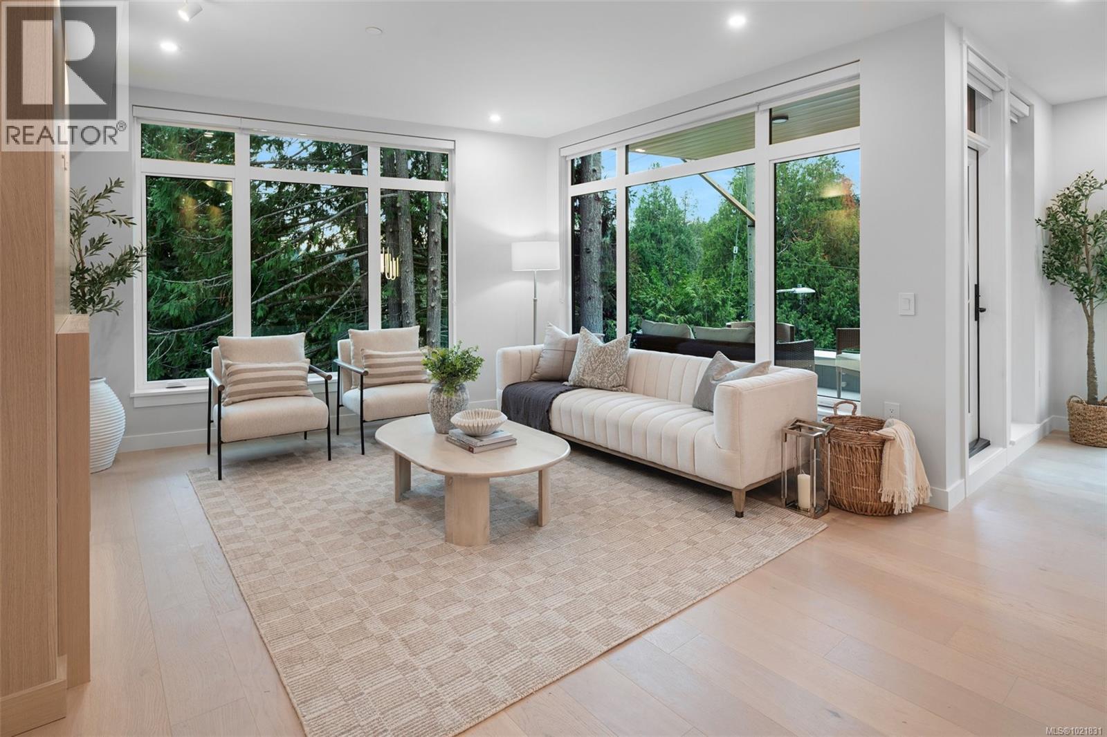 Show suite image used for finishings reference. Layout differs in the listed unit. - 206 5229 Cordova Bay Rd, Saanich, BC - Indoor Photo Showing Living Room