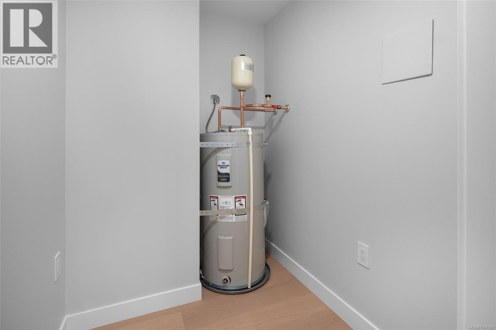 Show suite image used for finishings reference. Layout differs in the listed unit. - 206 5229 Cordova Bay Rd, Saanich, BC - Indoor Photo Showing Laundry Room