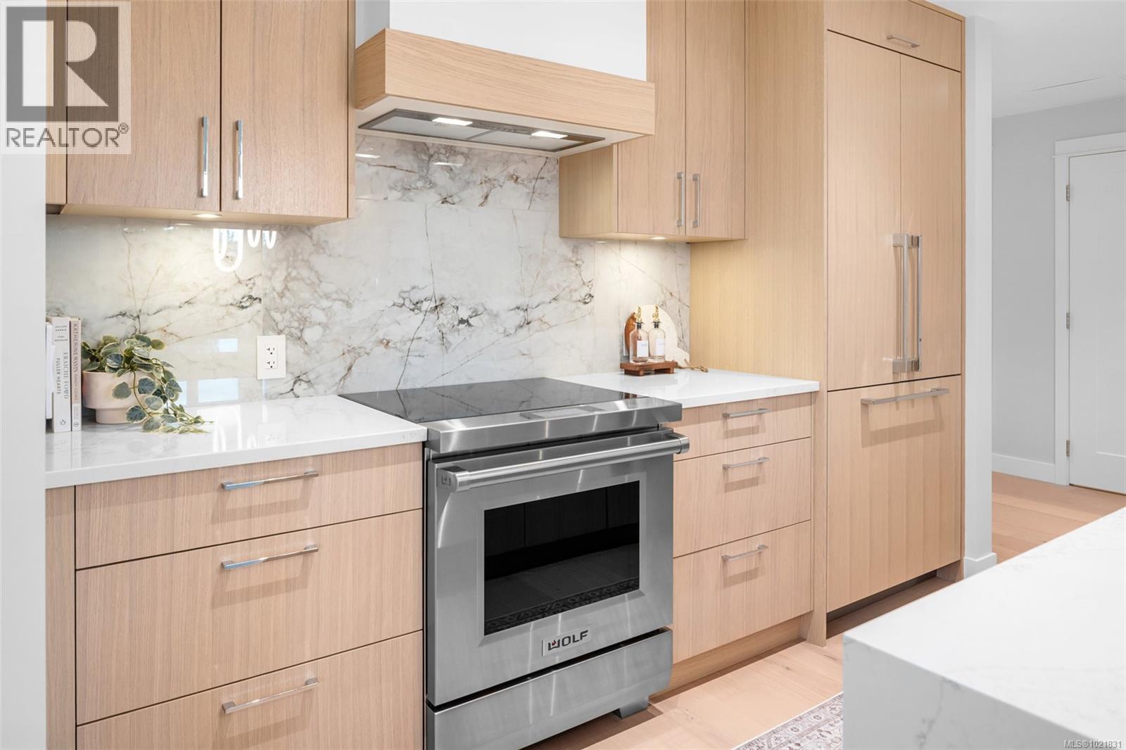 Show suite image used for finishings reference. Layout differs in the listed unit. - 206 5229 Cordova Bay Rd, Saanich, BC - Indoor Photo Showing Kitchen With Upgraded Kitchen