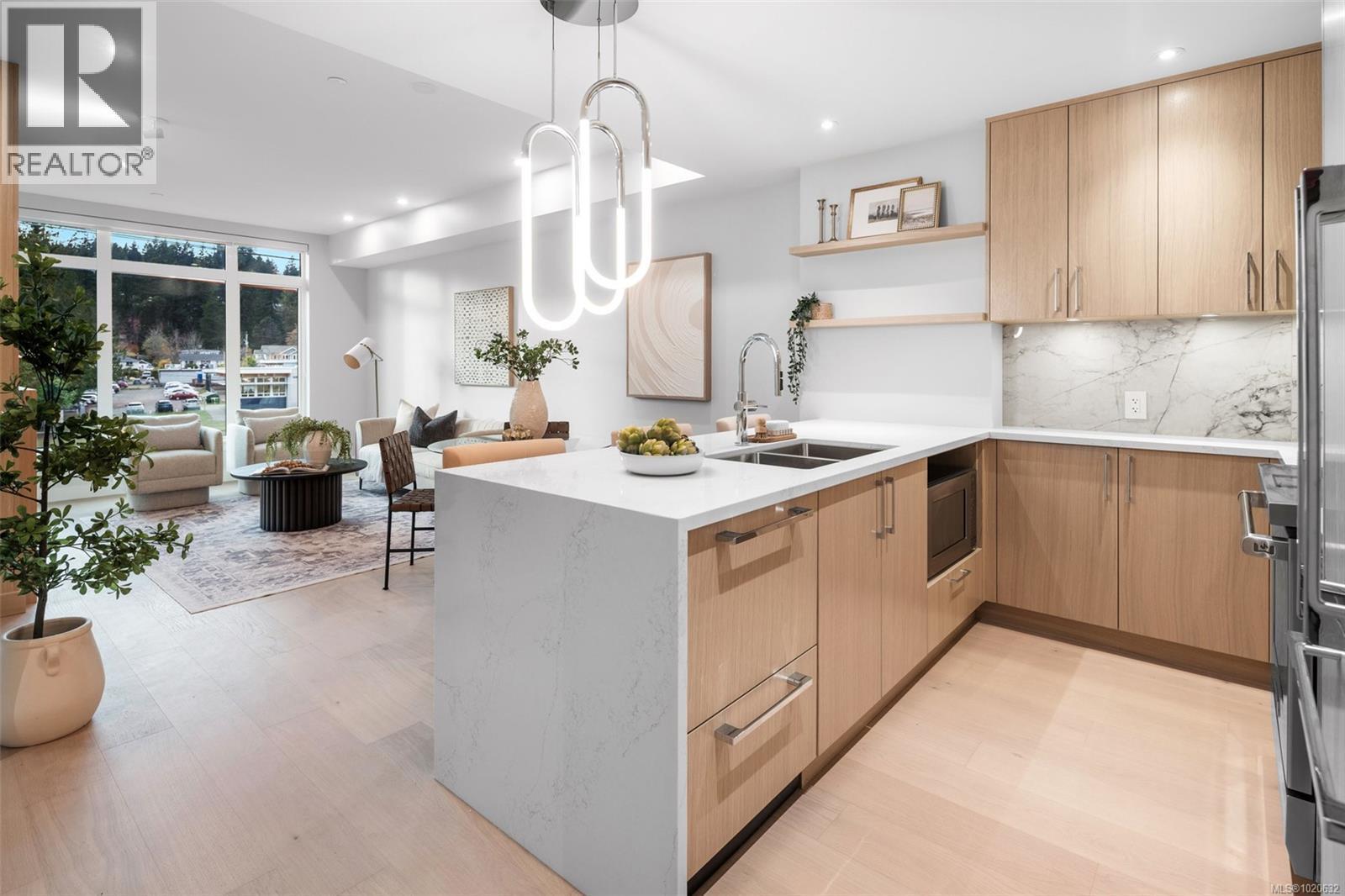 204 5229 Cordova Bay Rd, Saanich, BC - Indoor Photo Showing Kitchen With Double Sink With Upgraded Kitchen