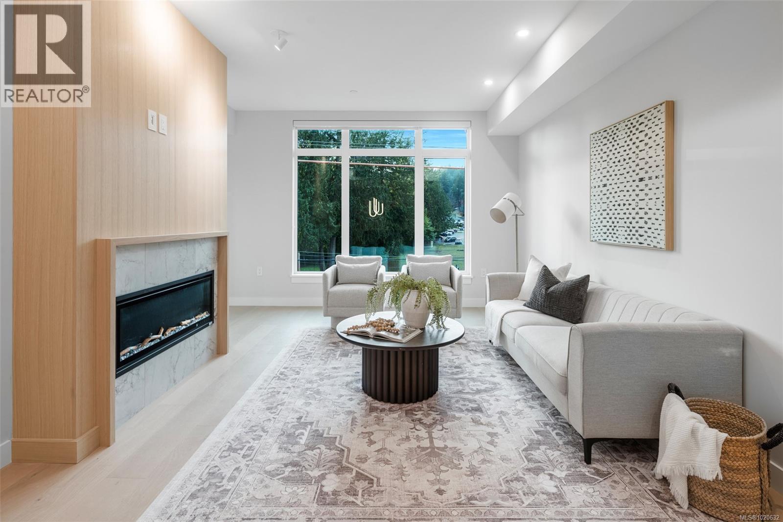 204 5229 Cordova Bay Rd, Saanich, BC - Indoor Photo Showing Living Room With Fireplace