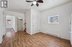 Kitchen w door to basement. -