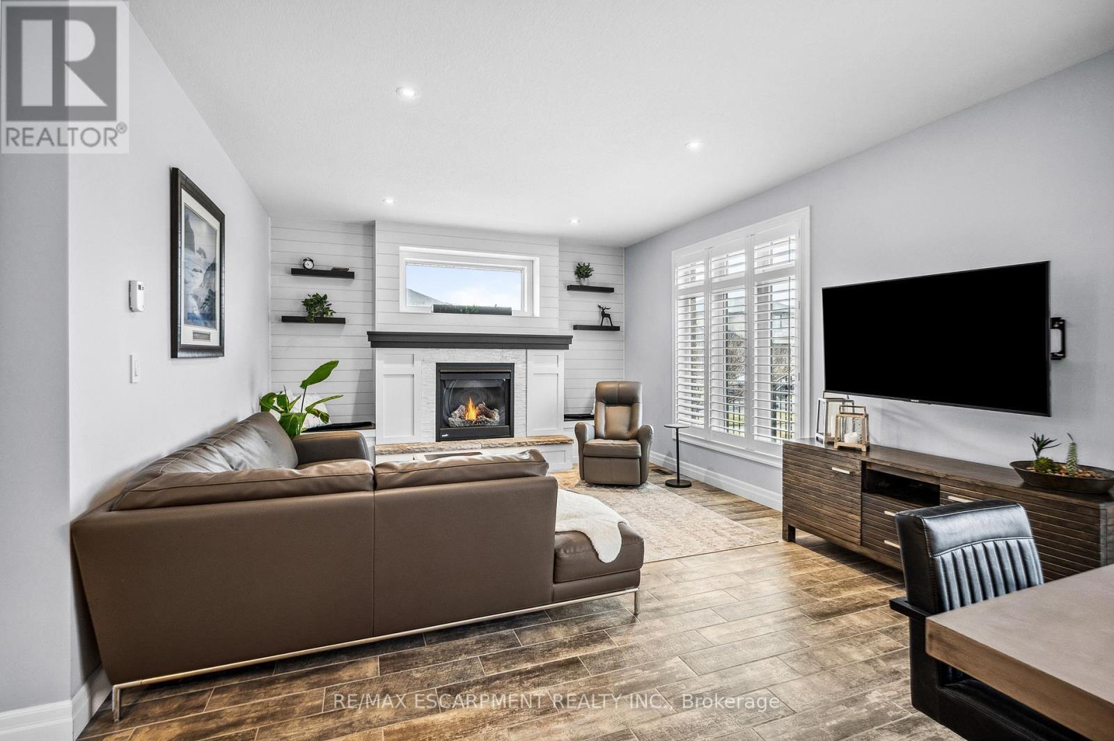 100 Tamarack Boulevard, Woodstock, ON - Indoor Photo Showing Living Room With Fireplace
