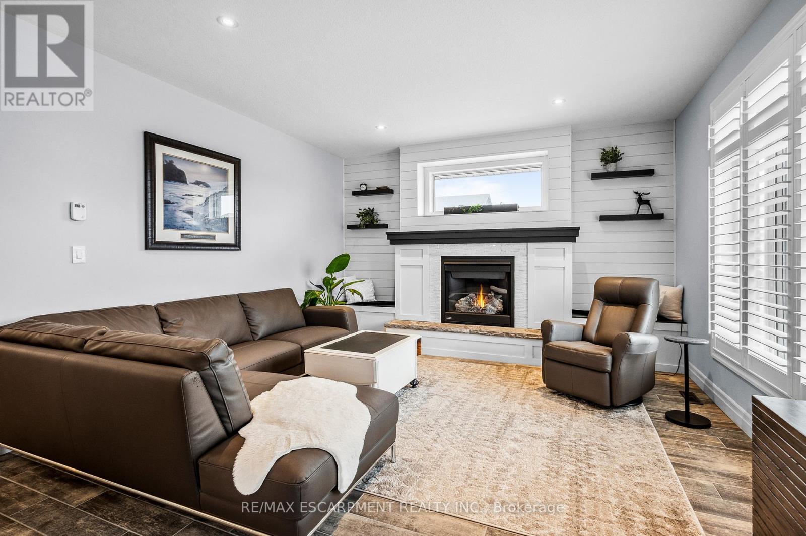 100 Tamarack Boulevard, Woodstock, ON - Indoor Photo Showing Living Room With Fireplace