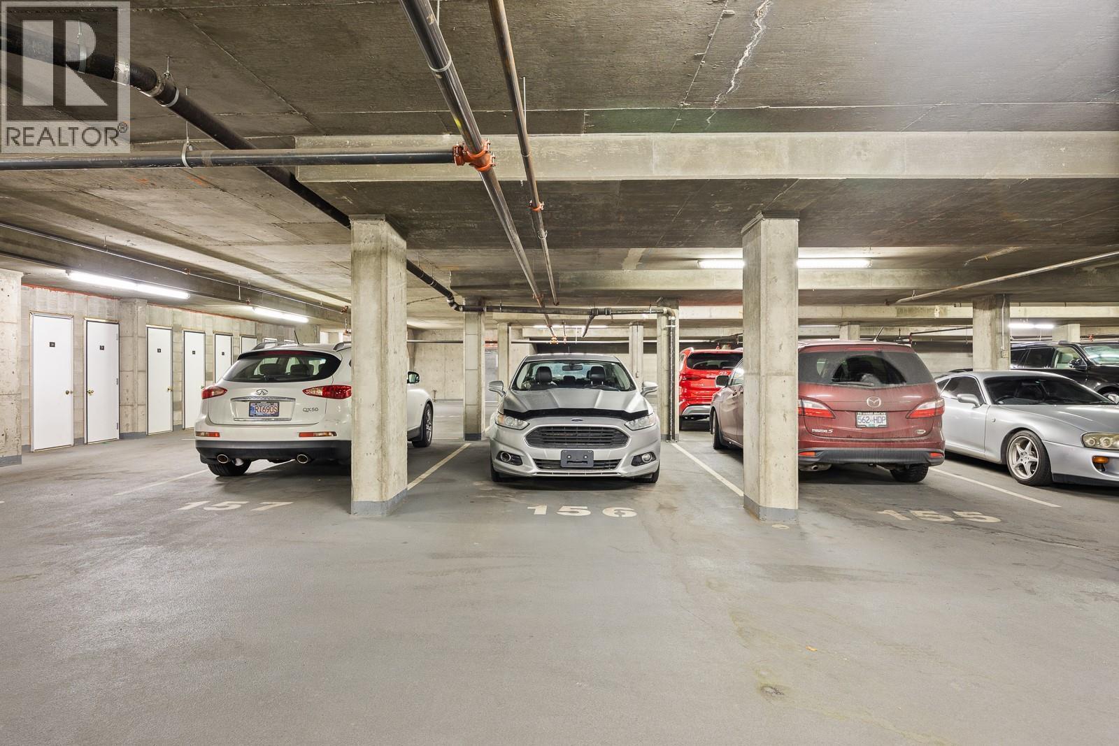 Parking Stall 156 -- Larger Stall -- 17 ft x 11.25 ft (Second Level) - 1128 Sunset Drive Unit# 803, Kelowna, BC - Indoor Photo Showing Garage