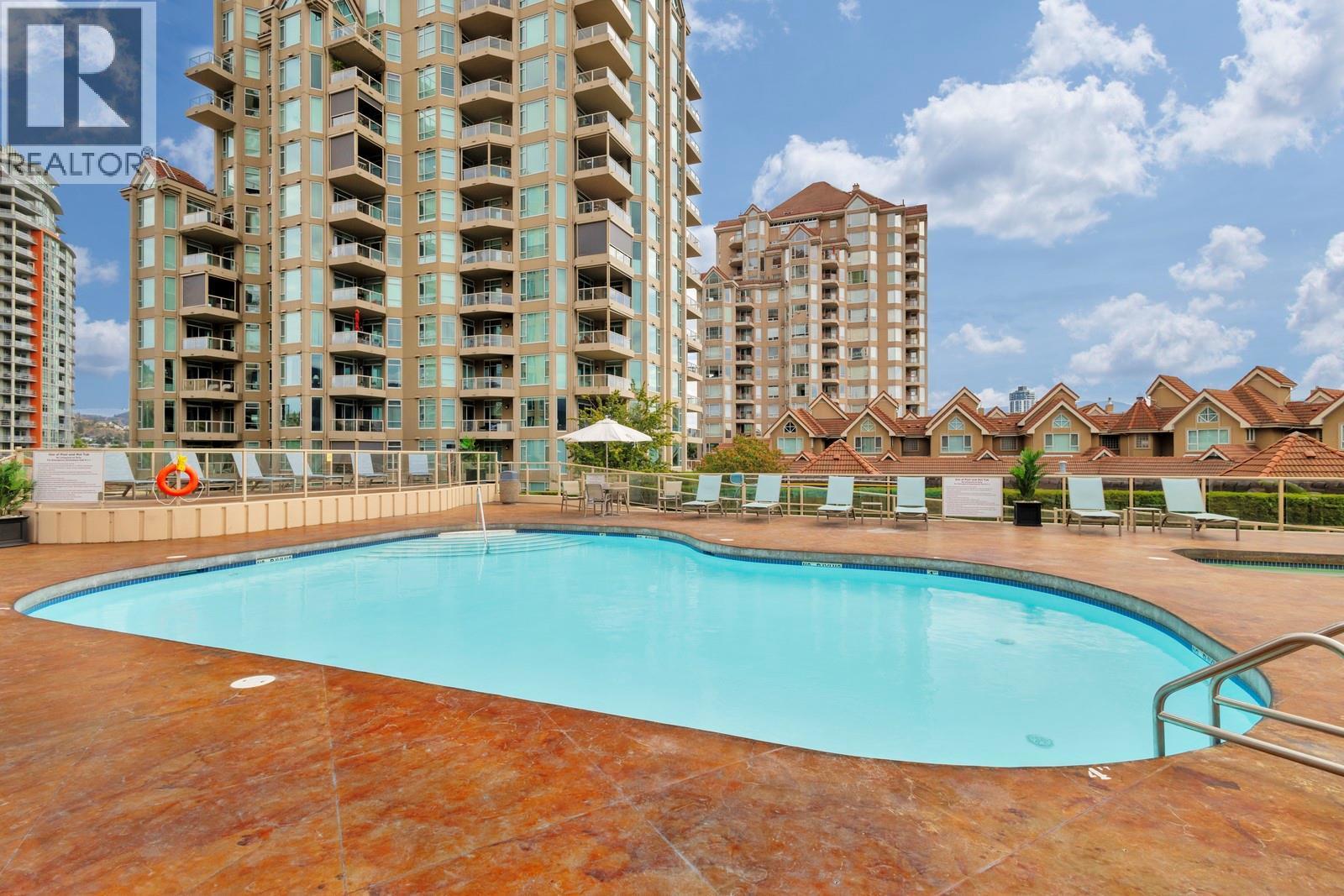 Outdoor Pool & Hot Tub -- 3rd Level - 1128 Sunset Drive Unit# 803, Kelowna, BC - Outdoor With In Ground Pool With Facade