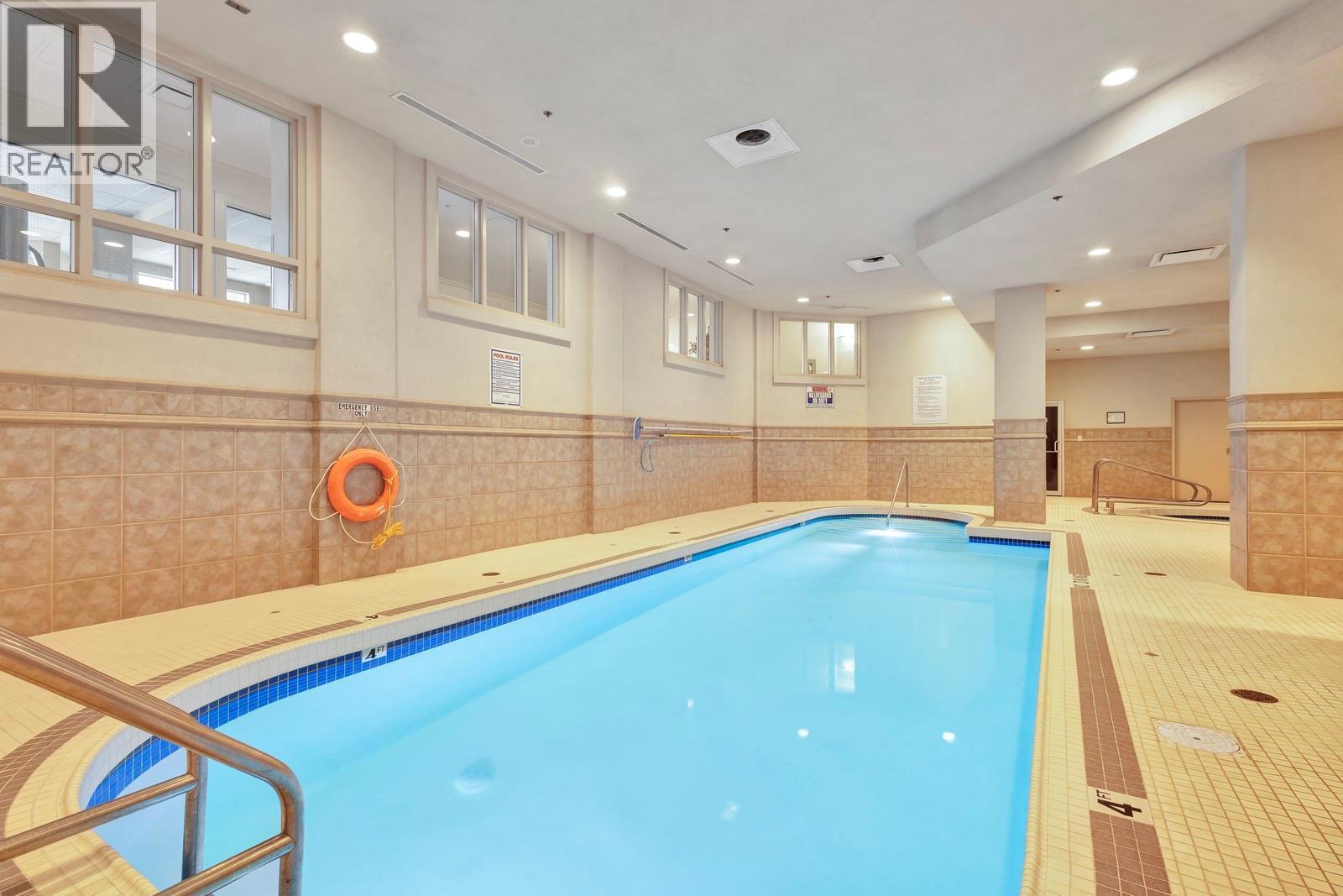 Indoor Pool & Hot Tub -- 2nd Level - 1128 Sunset Drive Unit# 803, Kelowna, BC - Indoor Photo Showing Other Room With In Ground Pool
