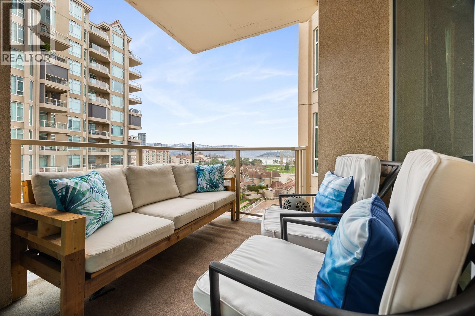 Covered patio with lake and bridge views!! - 1128 Sunset Drive Unit# 803, Kelowna, BC - With Exterior
