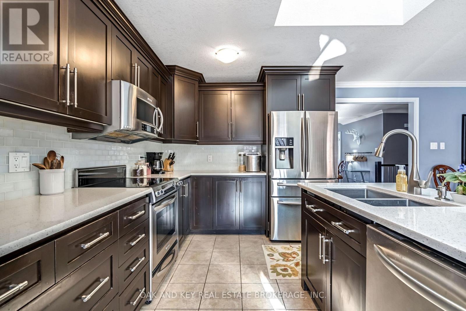Kitchen - 34 Fieldstone Crescent, Middlesex Centre (Komoka), ON - Indoor Photo Showing Kitchen With Double Sink With Upgraded Kitchen