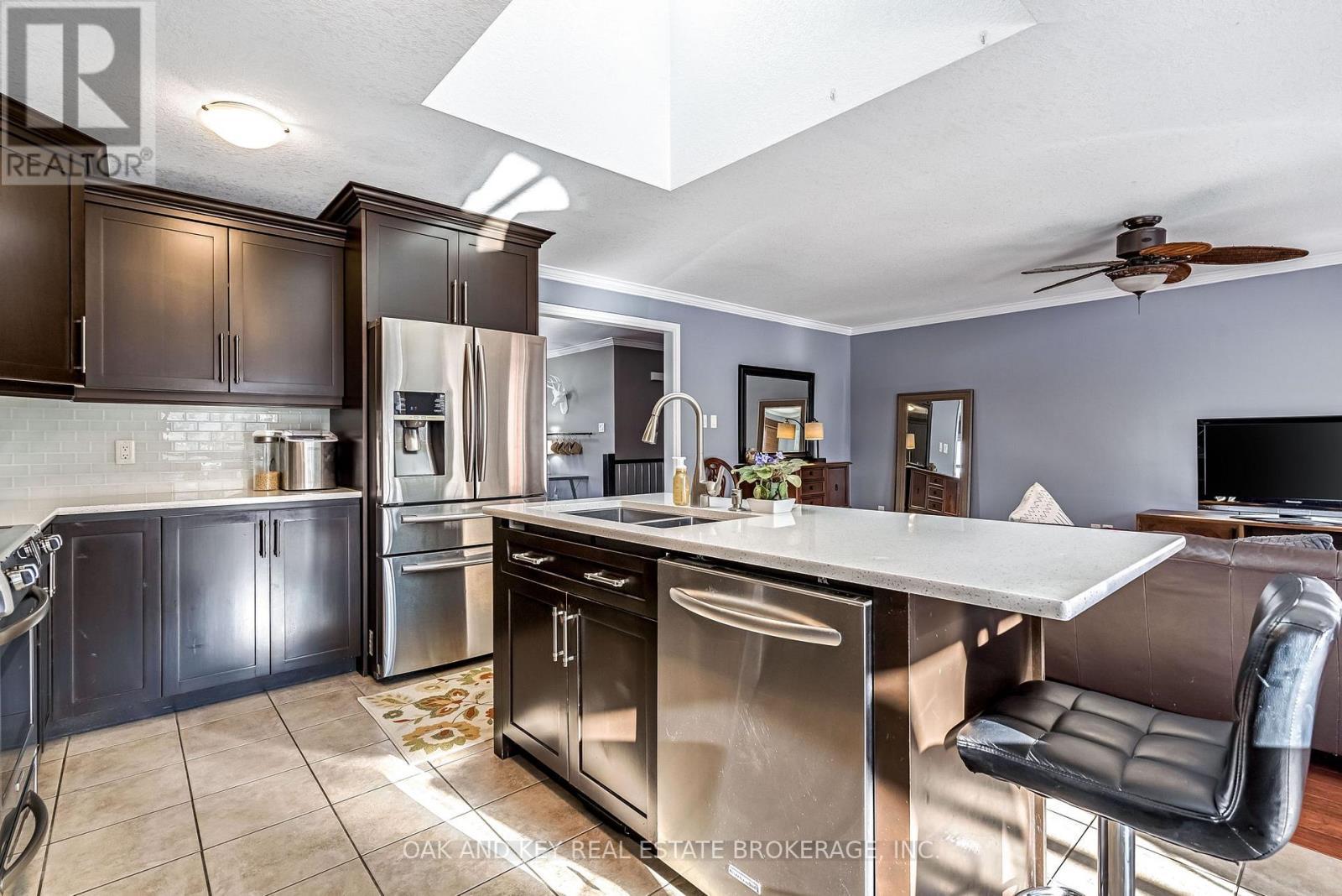 Kitchen - 34 Fieldstone Crescent, Middlesex Centre (Komoka), ON - Indoor Photo Showing Kitchen With Double Sink With Upgraded Kitchen