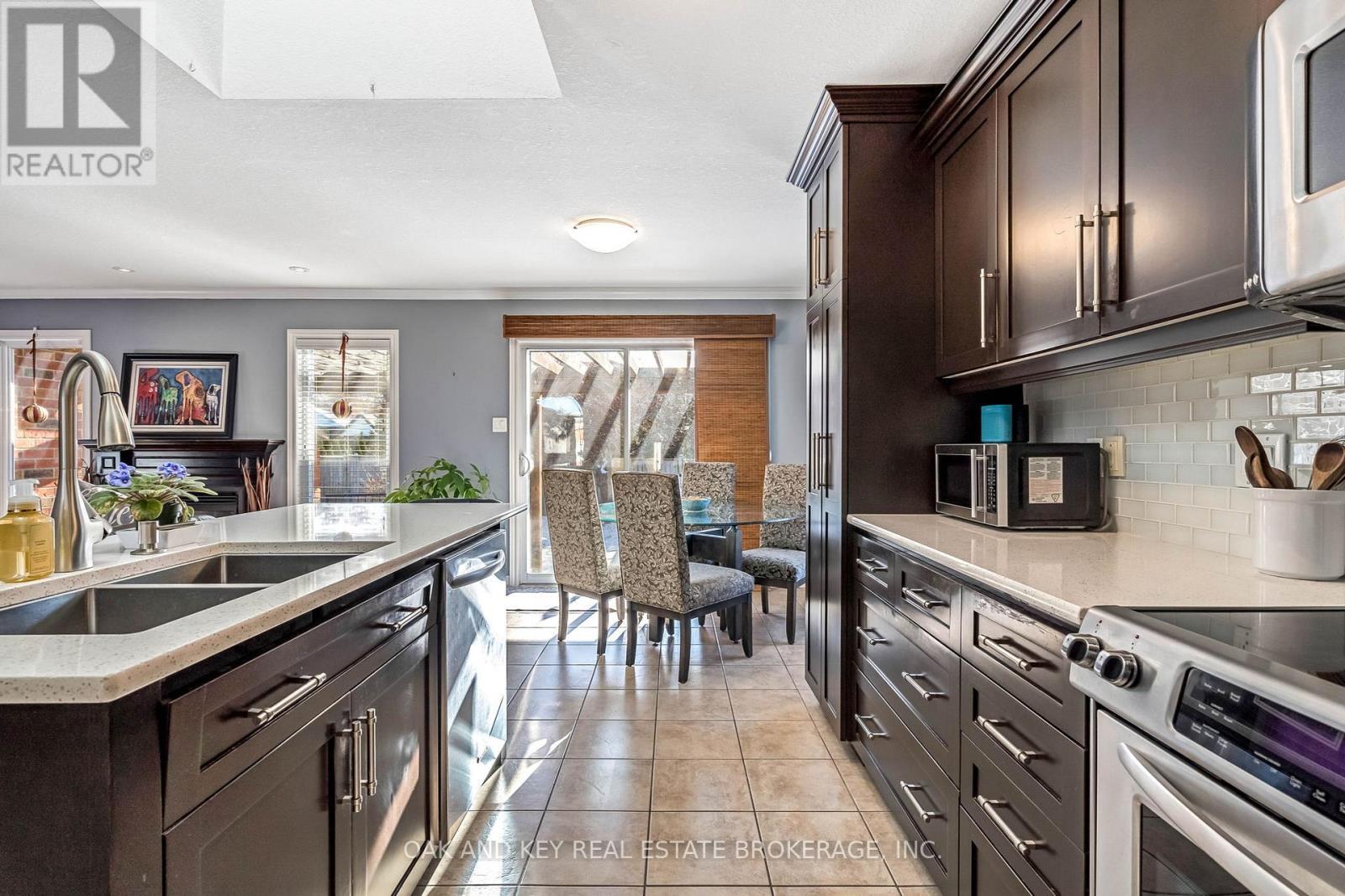 Open Concept Kitchen - 34 Fieldstone Crescent, Middlesex Centre (Komoka), ON - Indoor Photo Showing Kitchen With Double Sink